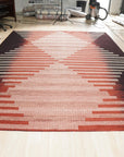 Dazzling Sleek Red Flatweave Wool Rug, vibrant red flatweave catches the light, its subtle texture adding depth to a modern living room setting.