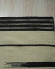 Sloane Majestic Gray Flatweave Wool Rug graces a bright, modern living room, its flatweave texture adding subtle sophistication to the hardwood floors and minimalist furniture.