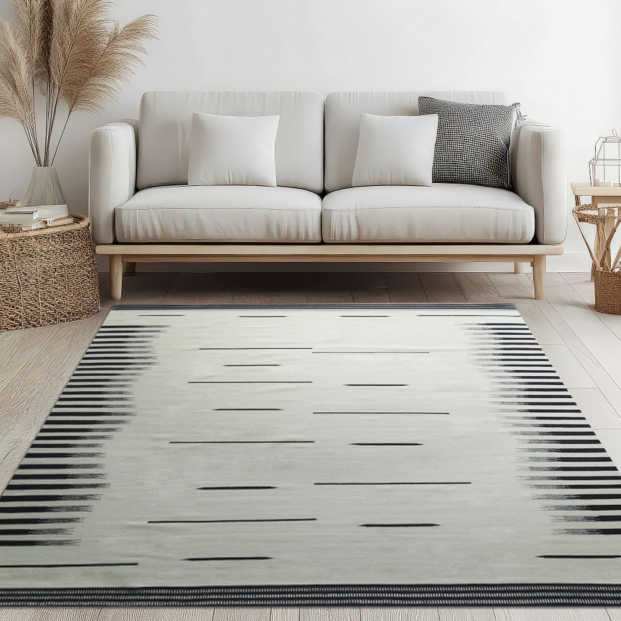 Sloane Majestic Gray Flatweave Wool Rug, a sophisticated and versatile gray wool rug with a subtle, textured flatweave, complementing a light and airy living room with modern furniture.