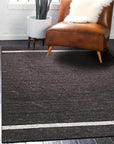 Violet Artistic Brown Flatweave Wool Rug, showcasing warm browns and subtle violet hues in a flatweave construction, lending a sophisticated yet understated style to a modern living space.