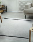 Artisan Nadia Ivory Flatweave Wool Rug, soft ivory tones and subtle texture enhance a bright, airy living room with minimalist décor. Woven wool adds warmth and sophistication.