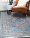 Refined Fiona Blue Handmade Wool Rug, showcasing subtle tonal variations across its hand-knotted wool pile, bathed in natural light, highlighting the depth and texture of its cool blue hues.