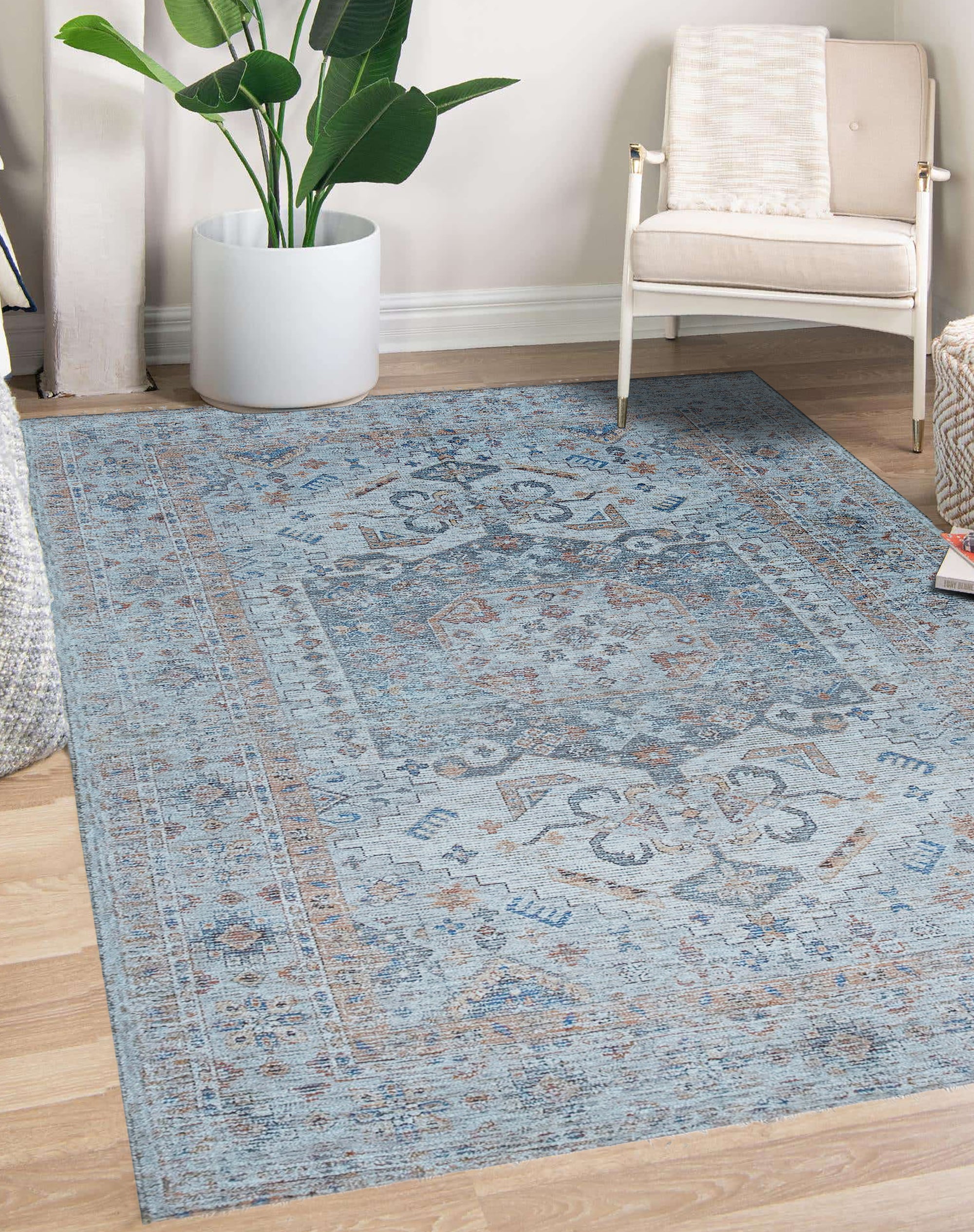 Fiona Vibrant Ivory Handmade Wool Rug, its soft ivory wool and subtle texture inviting comfort, sits gracefully on a light wood floor, hinting at a calm and inviting space.
