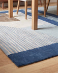 Bespoke Iris Multicolor Hand Tufted Wool Rug in a dining room