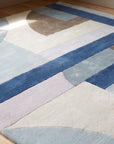 Bespoke Iris Multicolor Hand Tufted Wool Rug in a reading nook