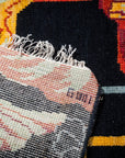 Black floral contemporary rug hand-knotted back detail