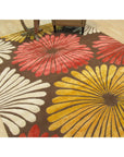Brown transitional floral rug styled in a living room