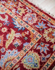 Burgundy Oushak rug corner and border detail