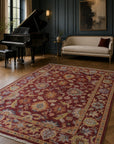 Burgundy Oushak floral rug styled in an elegant sitting room