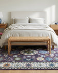 Cassandra Kazak Purple Hand Knotted Wool Rug in a bedroom