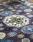 Cassandra Kazak Purple Hand Knotted Wool Rug in a living room