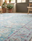 Celia Modern Green Hand Knotted Silk Rug in a sunroom