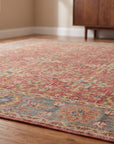Celia Oushak Rust Hand Knotted Wool Rug in a dining room