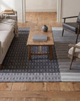 Clara Xena Charcoal Flatweave Wool & Cotton Rug in a living room