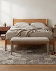 Cozy Quinn Gray Hand Tufted Wool Rug in a bedroom