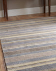 Ella Rustic Brown and Blue Handmade Wool Rug in a entryway