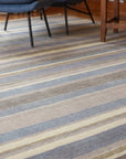 Ella Rustic Brown and Blue Handmade Wool Rug in a reading nook