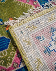 Green and fuchsia Kazak rug hand-knotted back and pile detail