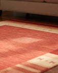 Handloomed Red Gabbeh Tribal Wool Area Rug in a living room
