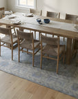Harlow Traditional Blue and Gray Hand Knotted Wool Rug in a dining room