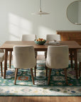 Isla Kazak Green Hand Knotted Wool Rug in a dining room