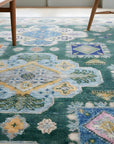 Isla Kazak Green Hand Knotted Wool Rug in a sunroom