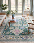 Isla Kazak Green Hand Knotted Wool Rug in a sunroom