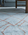 Isla Moroccan Blue Hand Knotted Wool Rug in a living room