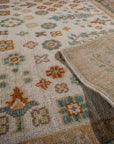 Ivory Oushak rug field and hand-knotted back detail