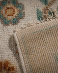 Ivory Oushak rug back and fringe detail
