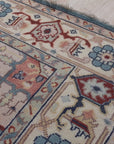 Ivory medallion rug corner and floral border detail