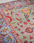 Light green Oushak rug field and border detail