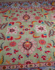 Light green Oushak rug top-down field detail