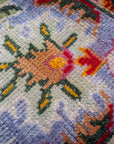Light green Oushak rug floral motif close-up