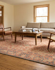 Lydia Jasmine Red Hand Knotted Wool Rug in a living room