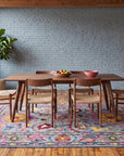 Maya Artisan Blue Hand Tufted Wool Rug in a dining room