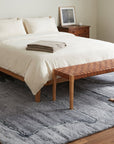 Maya Classic Purple and Gray Hand Knotted Wool Rug in a bedroom