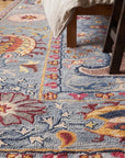Maya Timeless Blue Hand Tufted Wool Rug in a bedroom