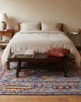 Maya Timeless Blue Hand Tufted Wool Rug in a bedroom