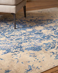 Modern Classic Blue Machine Made Rug in a reading nook