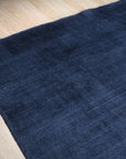 Navy blue solid handmade wool and viscose rug