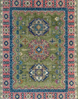 Distressed olive green traditional rug with intricate navy blue and dusty rose borders and geometric designs.
