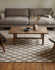 Ophelia Timeless Beige Hand Tufted Wool Rug in a living room