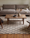 Ophelia Timeless Beige Hand Tufted Wool Rug in a living room