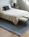 Opulent Majestic Blue Flatweave Wool Rug in a bedroom