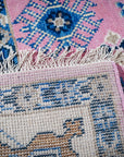 Pink ivory Kazak rug hand-knotted back and fringe detail