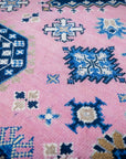 Pink ivory Kazak rug field close-up