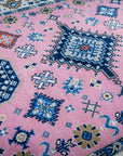 Pink ivory Kazak rug field and medallion detail