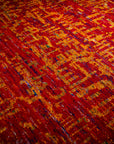 Sari-silk red abstract Anand rug angled field detail