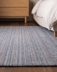 Radiant Chic Multicolor Handmade Wool Rug in a bedroom